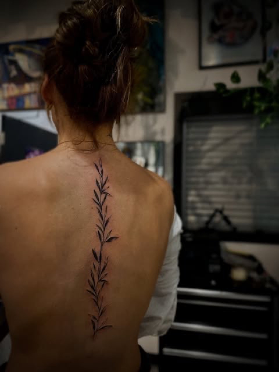 Spine fine line script tattoo by BlacMars at Yes Electric Tattoo Toronto