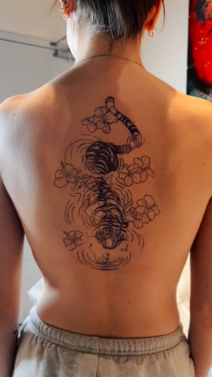Black and grey tiger and floral tattoo by Lux at Yes Electric Tattoo Toronto