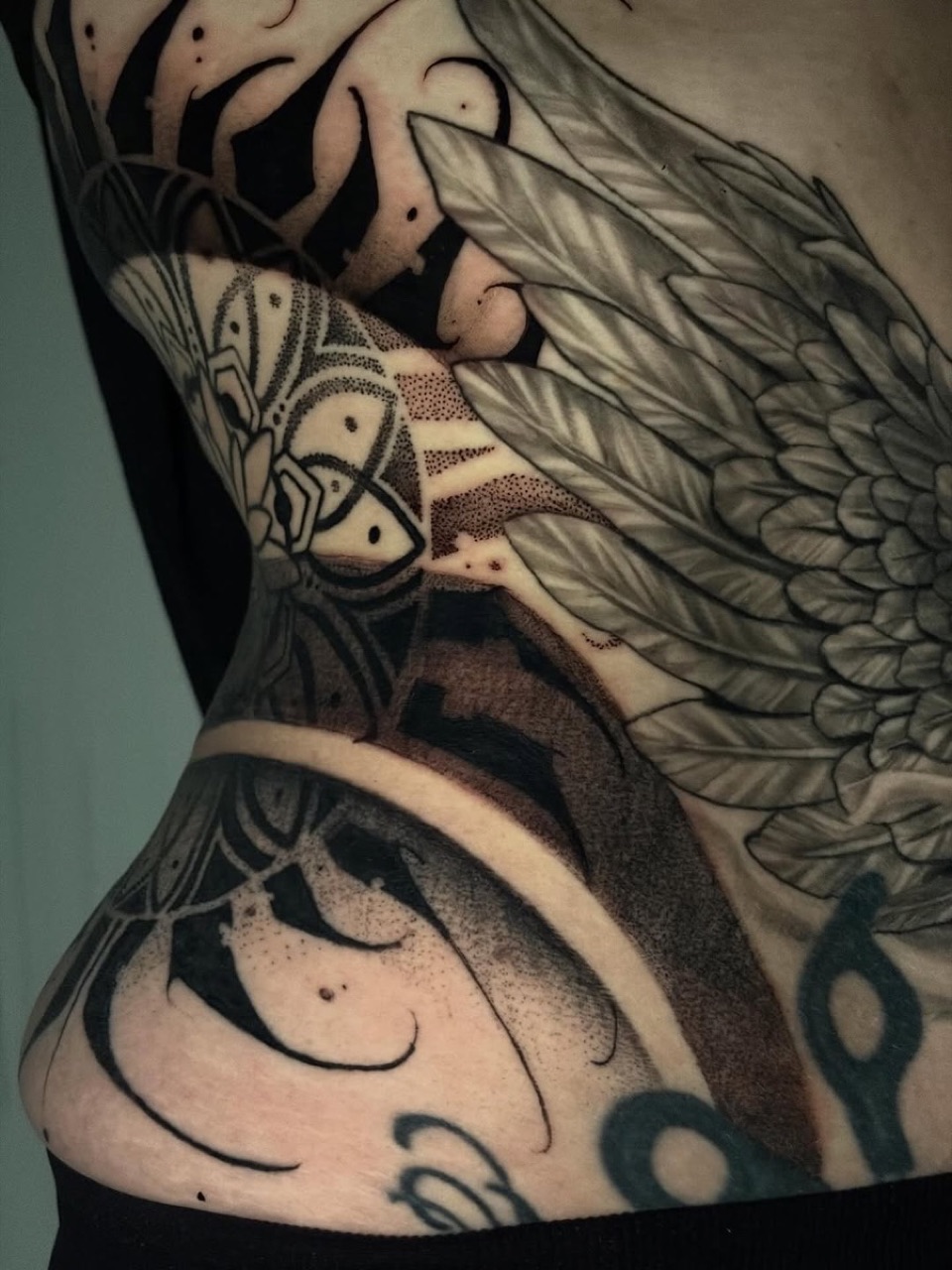 Mandala and floral black and grey leg tattoo at Yes Electric