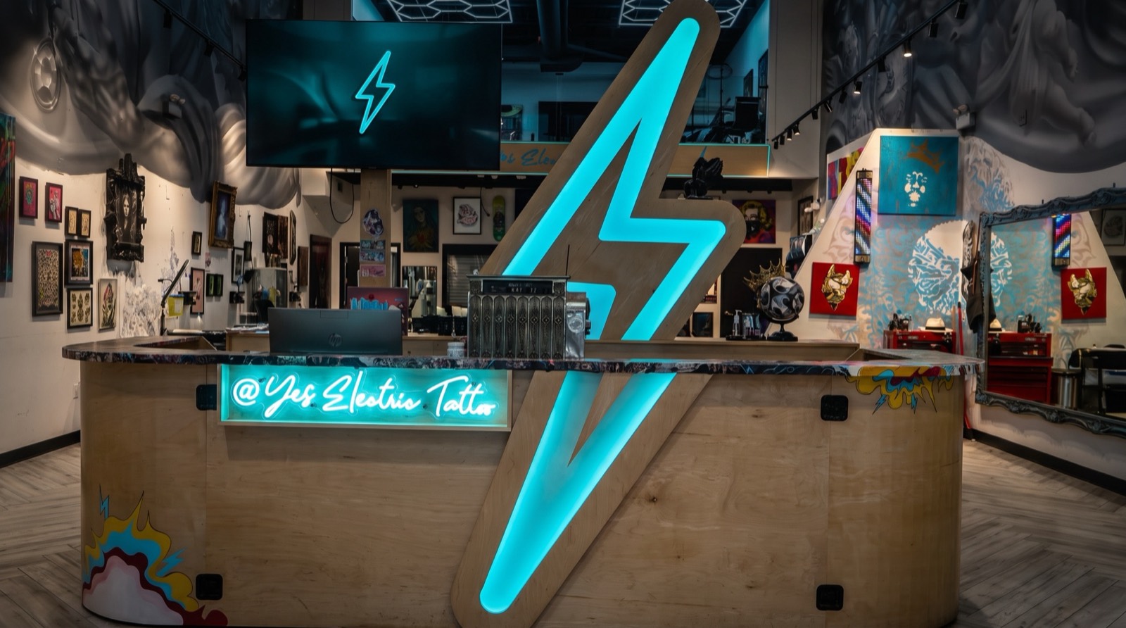 The Yes Electric front desk and neon lightning bolt on Queen West